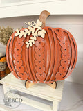 Hand painted Sweater Pumpkin fall decor with layered wood details, natural wood stem and leaf accents.