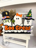 Boo Crew hand painted Halloween shelf sitter ghost decor with three colorful ghosts and layered BOO CREW lettering.