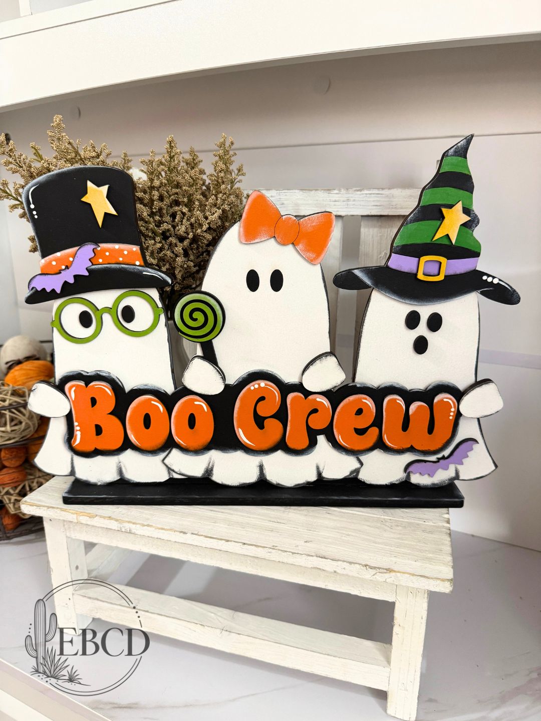Boo Crew hand painted Halloween shelf sitter ghost decor with three colorful ghosts and layered BOO CREW lettering.