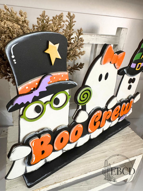 Boo Crew hand painted Halloween shelf sitter ghost decor with three colorful ghosts and layered BOO CREW lettering.