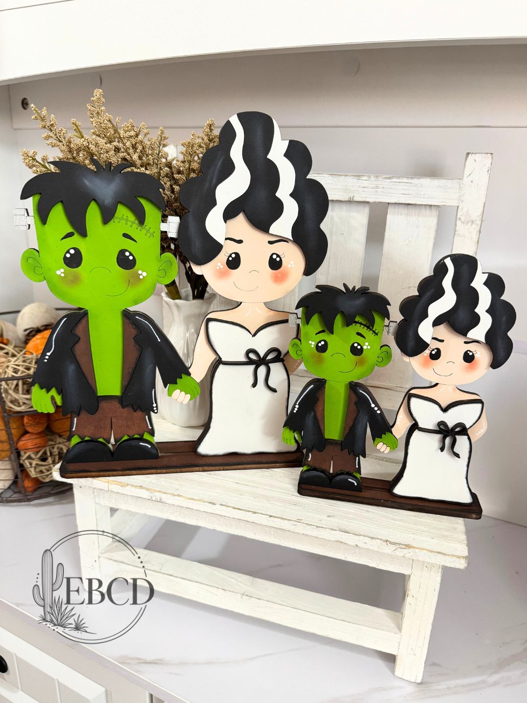 Hand painted Frankenstein and Bride Halloween decor.