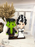 Hand painted Frankenstein and Bride Halloween decor.