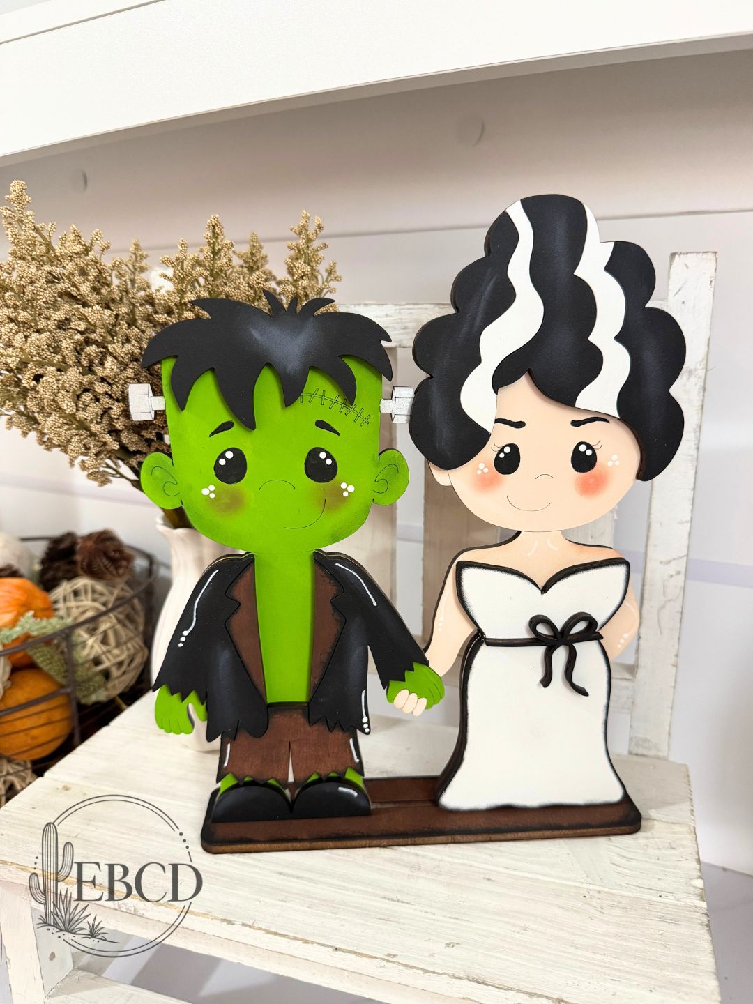 Hand painted Frankenstein and Bride Halloween decor.