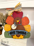 Hand painted Give Thanks Thanksgiving turkey decor with colorful layered feathers available in 10inch, 14inch or 18inch tall.