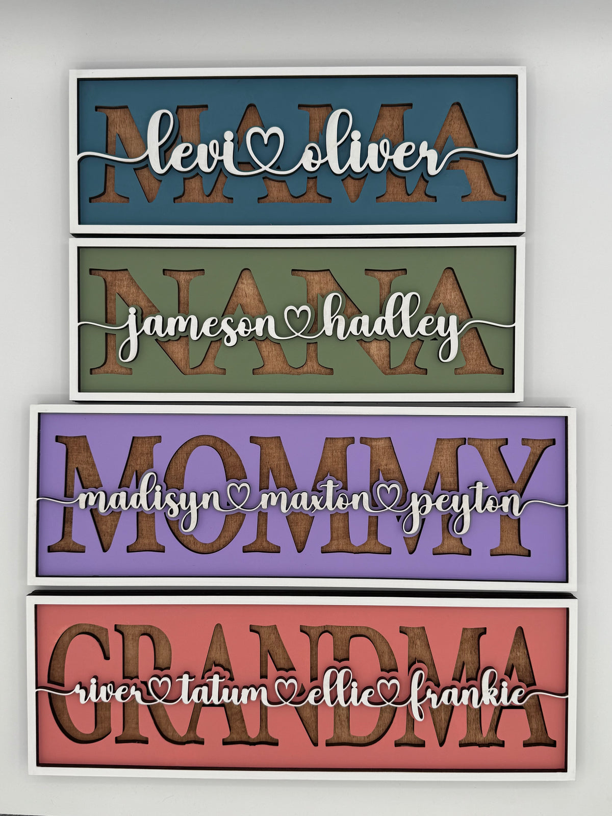 Personalized hand painted layered wood name sign with family names.